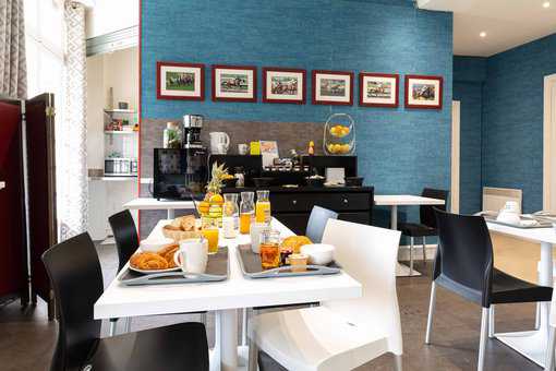 Breakfast area in the reception of the Goélia Le Castel Normand holiday residence in Deauville