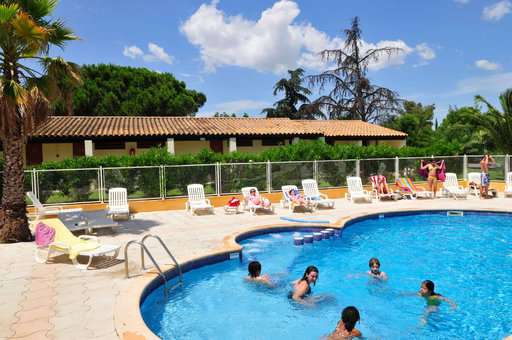 Outdoor swimming pool at Le Mas Blanc holiday residence in Pérols, Occitania