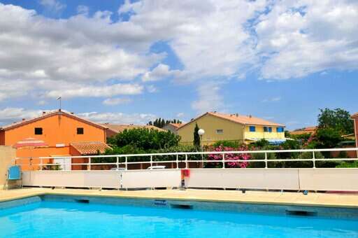 Outdoor swimming pool at Le Sun Village holiday residence in Portiragnes, Occitanie