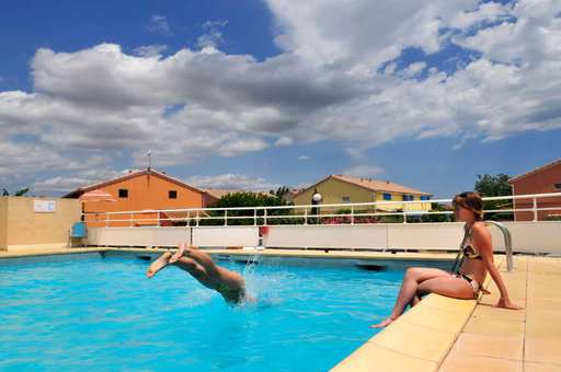 Outdoor swimming pool at Le Sun Village holiday residence in Portiragnes, Occitanie
