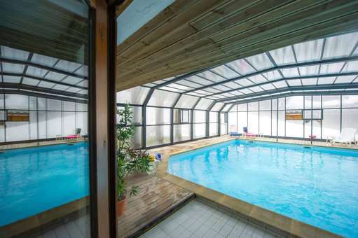 Indoor heated swimming pool of the vacation residence Goélia Le Village Gaulois in St François Longchamp