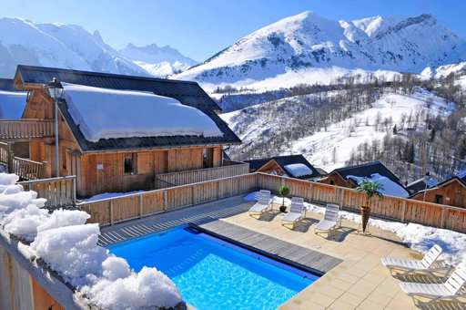 Heated outdoor swimming pool of the vacation residence Goélia Les Chalets des Ecourts in St Jean d'Arves