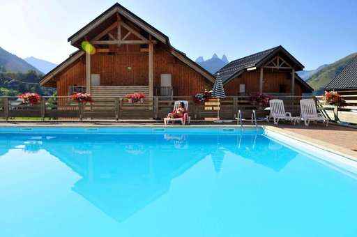 Heated outdoor swimming pool of the vacation residence Goélia Les Chalets des Marmottes in St Jean d'Arves
