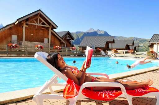 Heated outdoor swimming pool of the vacation residence Goélia Les Chalets des Marmottes in St Jean d'Arves