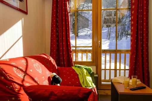 Example of a living room in the vacation residence Goélia Les Chalets de Belledonne in St Colomban Les Sybelles