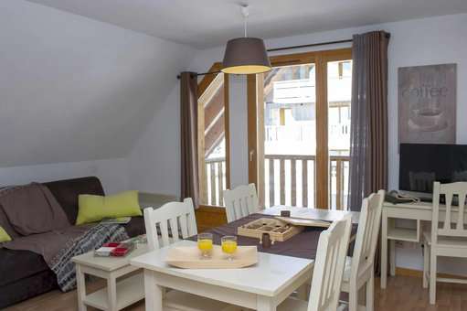 Example of living room of the residence of vacation Goélia Les Chalets de Super-Besse in the Massif Central