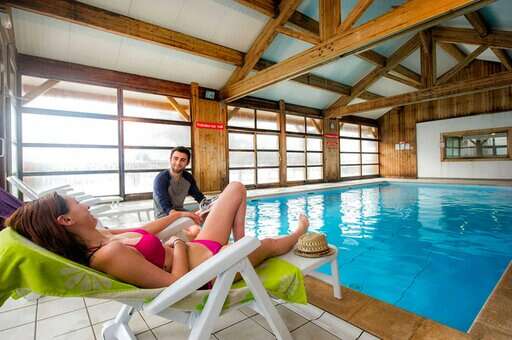 Heated indoor swimming pool of the vacation residence Goélia Les Chalets de St Sorlin in St Sorlin d'Arves in the Alps