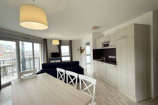 Example of a living room with kitchenette at the Goélia le Phare holiday residence in Le Tréport