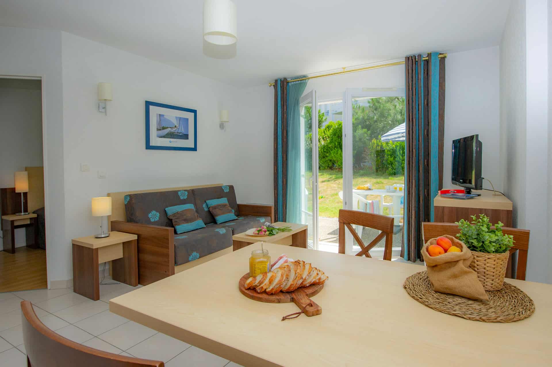 Salon d'un logement de la résidence de vacances Goélia La Grande Plage à St-Gilles-Croix-de-Vie Salon d'un logement de la résidence de vacances Goélia La Grande Plage à St-Gilles-Croix-de-Vie