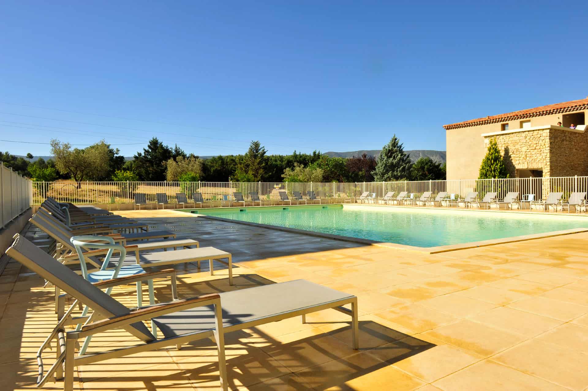 Outdoor heated swimming pool of the Goélia Le Domaine du Moulin Blanc holiday residence in Gordes Outdoor heated swimming pool of the Goélia Le Domaine du Moulin Blanc holiday residence in Gordes