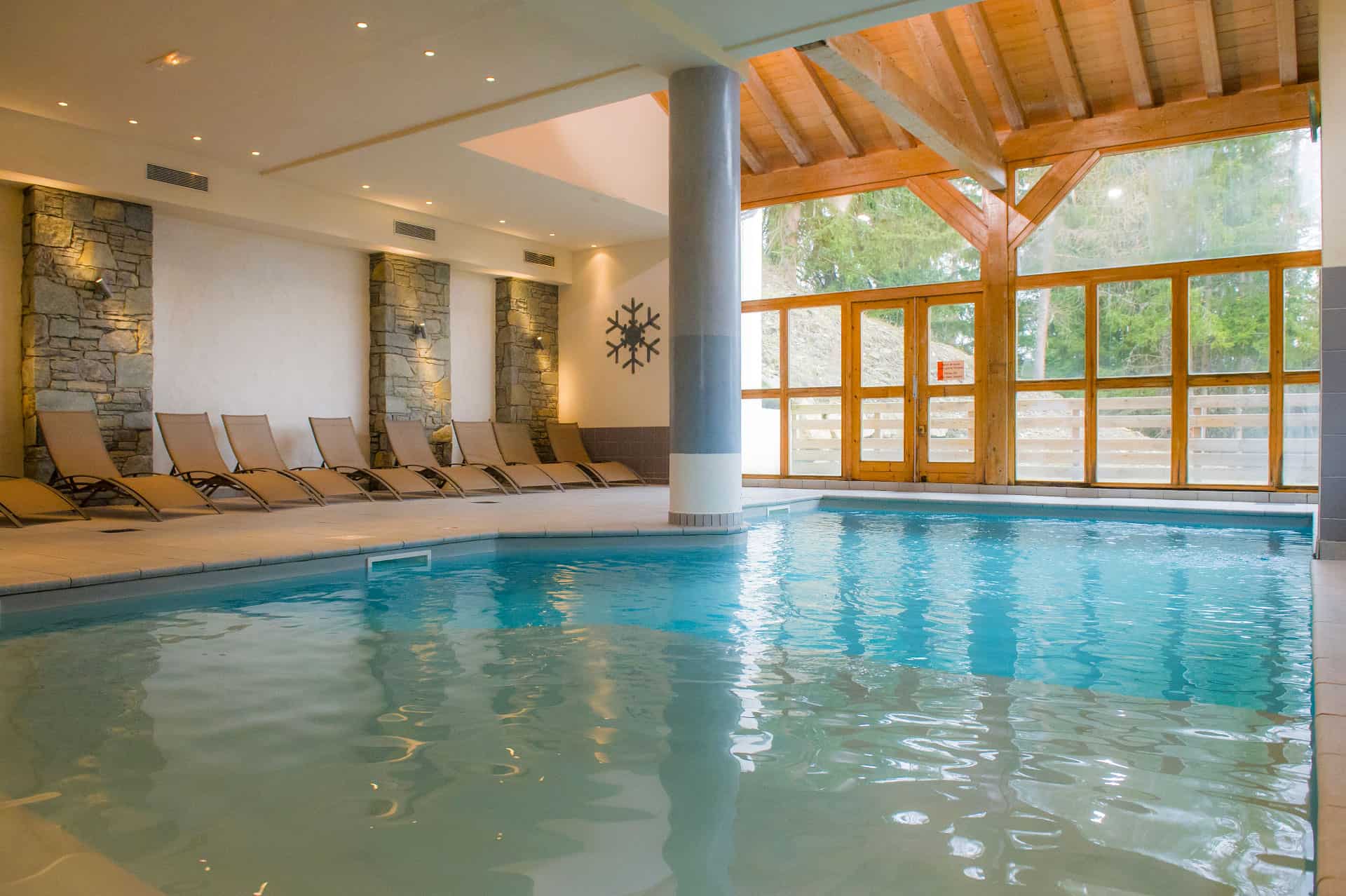 Indoor heated swimming pool in Les Chalets de Wengen holiday residence in Montchavin-la-Plagne, in the Northern Alps