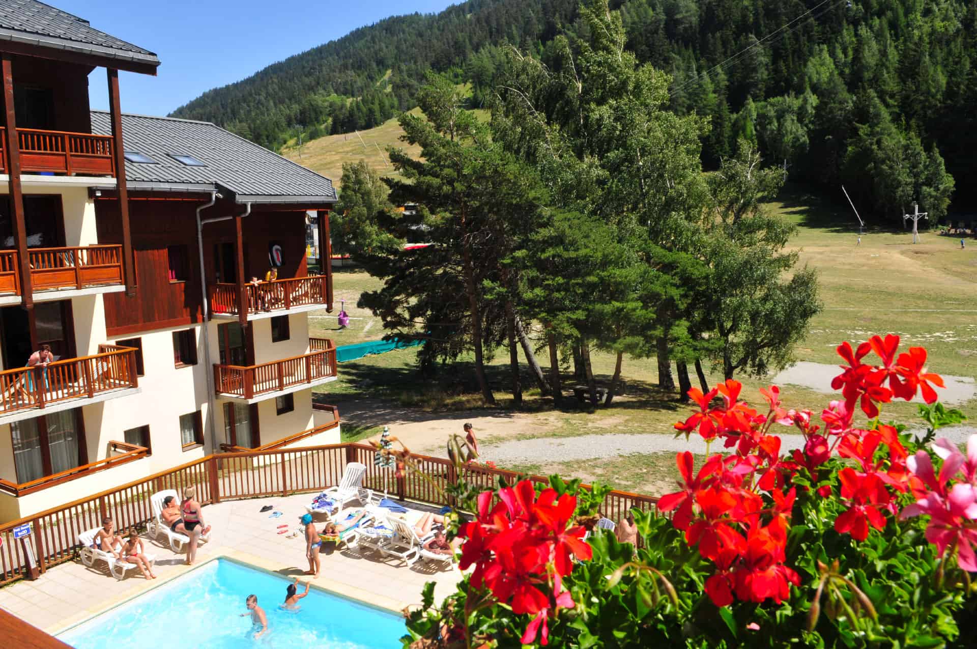 Heated outdoor swimming pool at Les Balcons d'Anaïs holiday residence in La Norma, in the Northern Alps