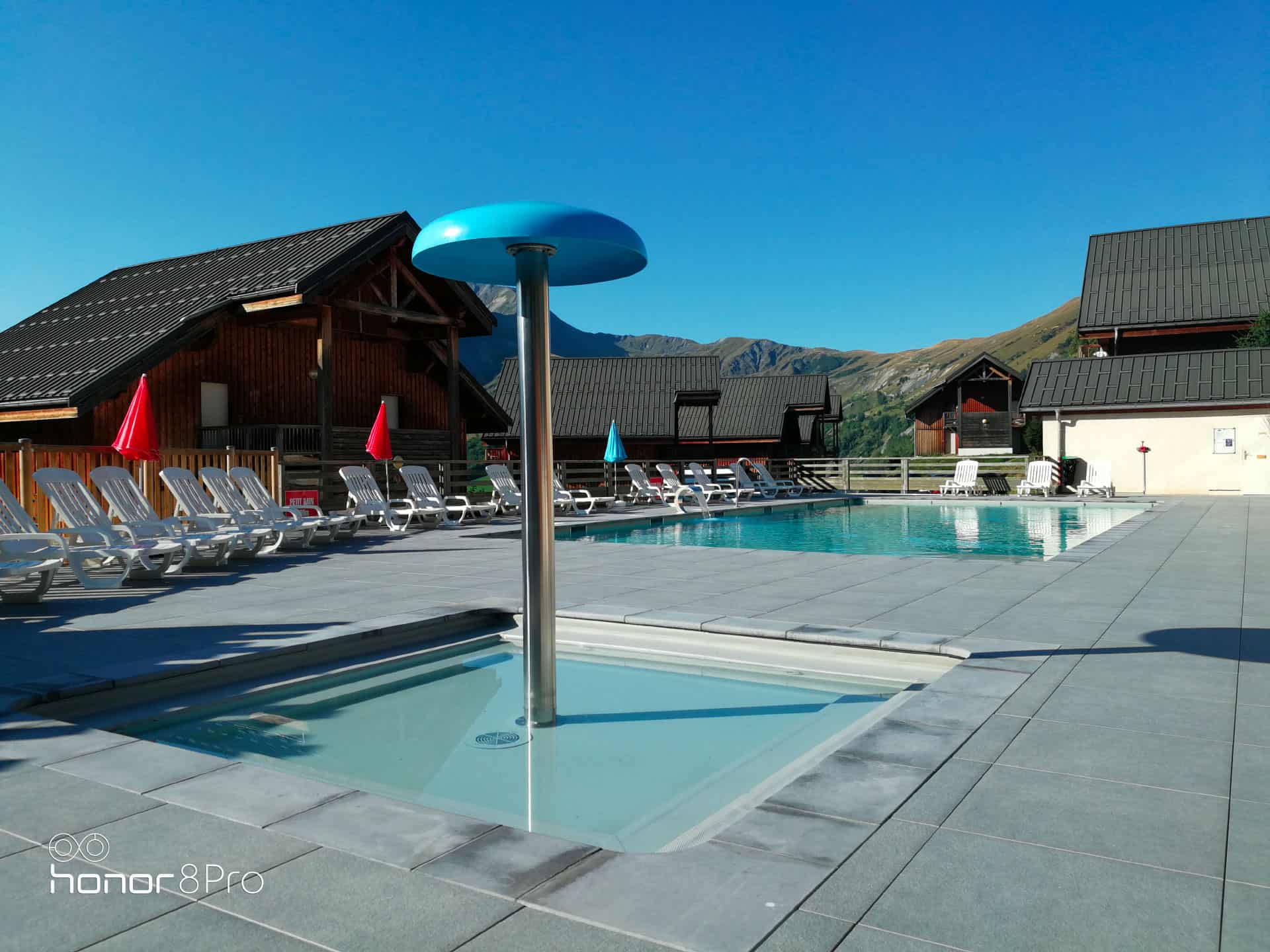 Heated outdoor swimming pool and children's pool of the vacation residence Goélia Les Chalets des Marmottes in St Jean d'Arves Heated outdoor swimming pool and children's pool of the vacation residence Goélia Les Chalets des Marmottes in St Jean d'Arves