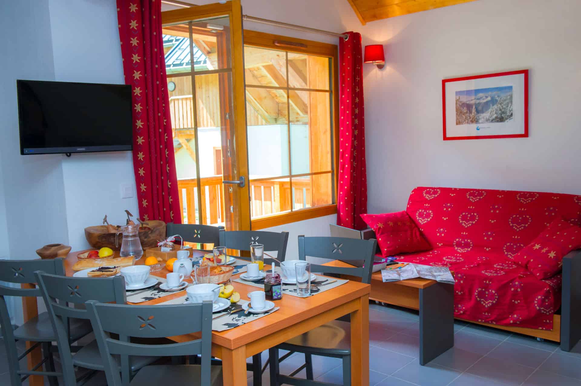Example of a living room in the vacation residence Goélia Les Chalets de Belledonne in St Colomban Les Sybelles Example of a living room in the vacation residence Goélia Les Chalets de Belledonne in St Colomban Les Sybelles