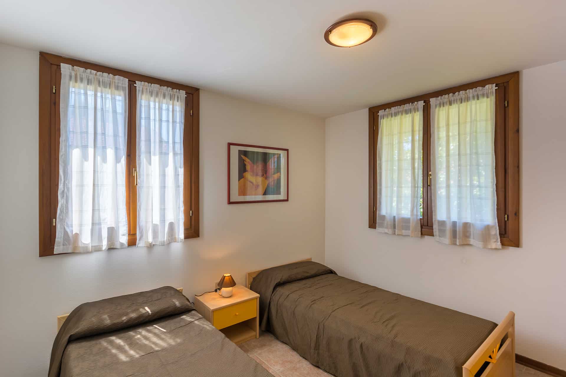 Chambre lits twins d'un V4 dans la résidence vacances Albarella en Italie  Chambre lits twins d'un V4 dans la résidence vacances Albarella en Italie