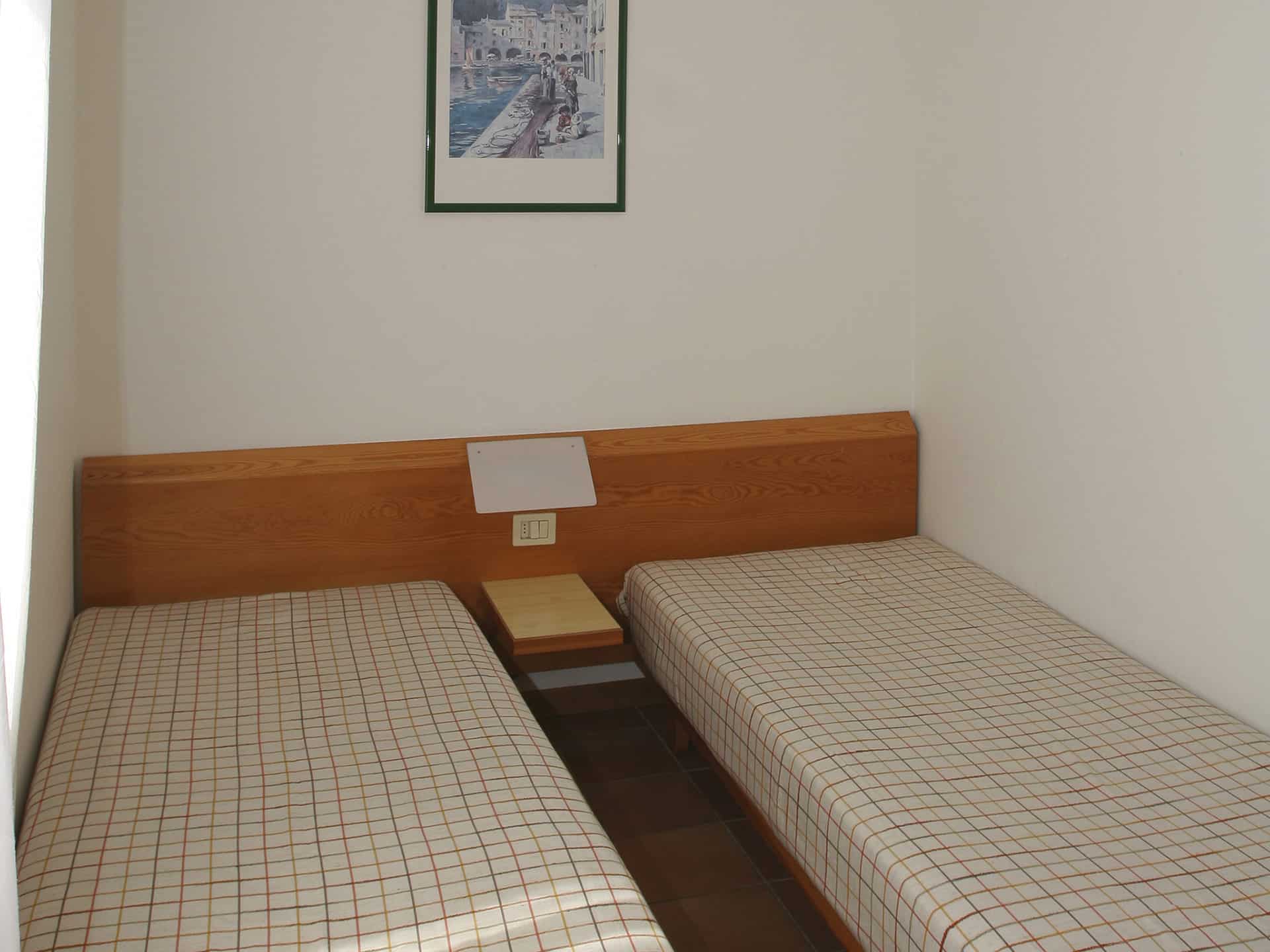 Exemple de chambre de la résidence de vacances San Carlo à Costermano, proche du Lac de Garde, en Italie Exemple de chambre de la résidence de vacances San Carlo à Costermano, proche du Lac de Garde, en Italie
