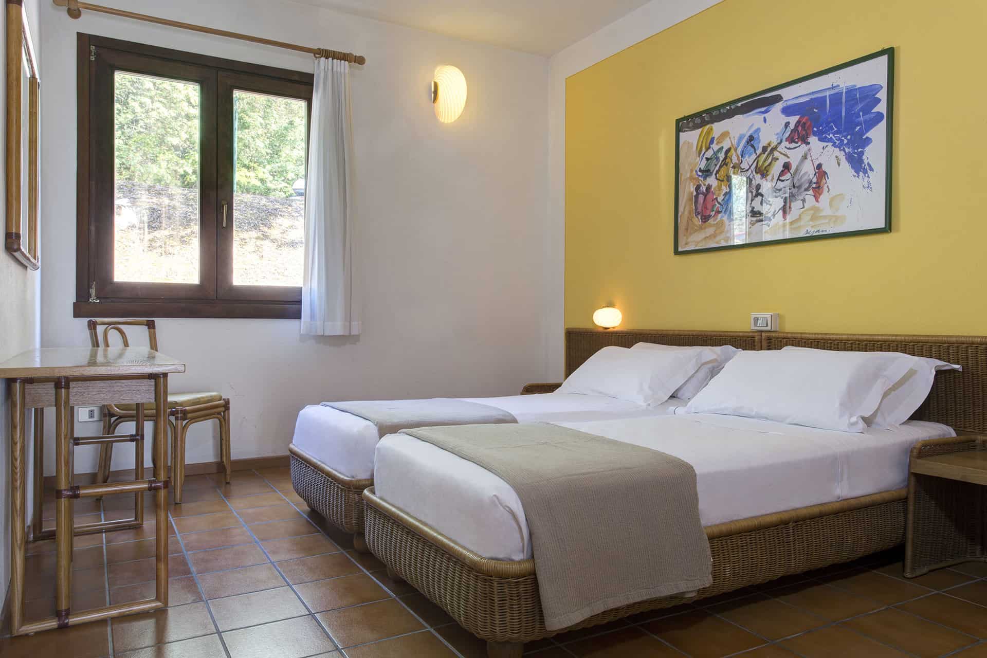 Exemple de chambre de la résidence de vacances Poiano Resort à Garda, proche du Lac de Garde, en Italie Exemple de chambre de la résidence de vacances Poiano Resort à Garda, proche du Lac de Garde, en Italie