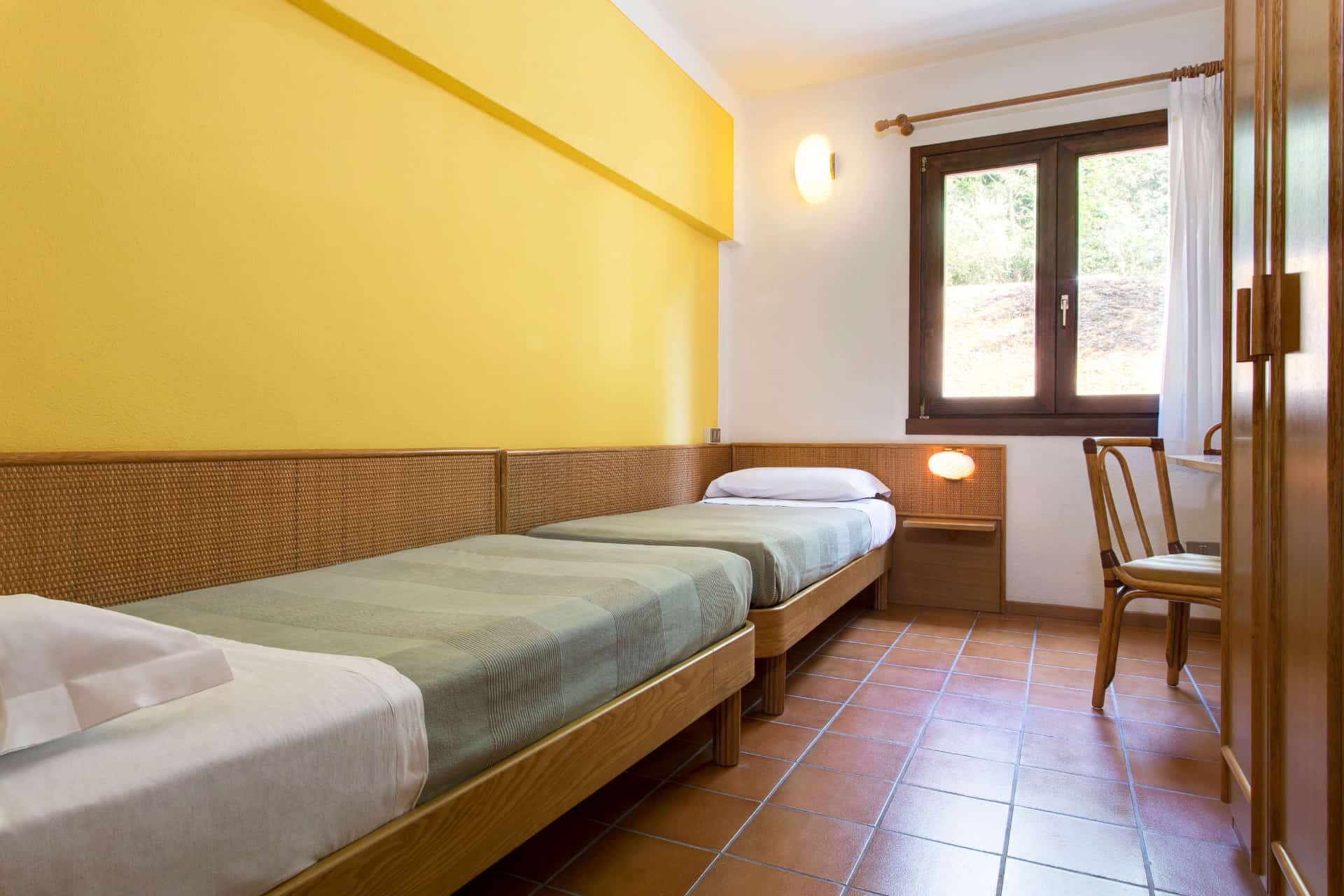 Chambre avec 2 lits simples de la résidence de vacances Poiano Resort à Garda, proche du Lac de Garde, en Italie Chambre avec 2 lits simples de la résidence de vacances Poiano Resort à Garda, proche du Lac de Garde, en Italie
