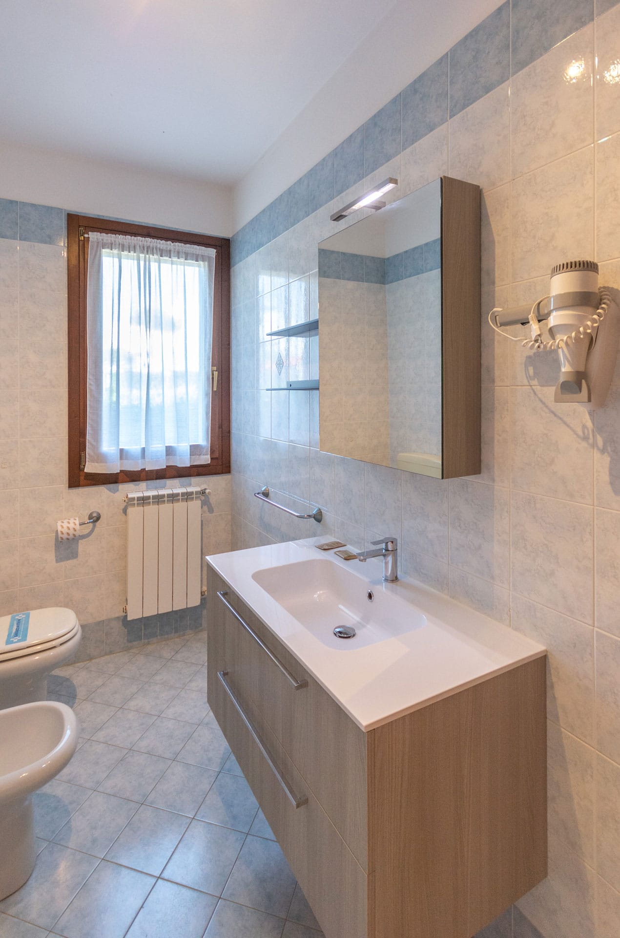 Exemple de salle de bain d'un V3 de la résidence de vacances Albarella en Italie Exemple de salle de bain d'un V3 de la résidence de vacances Albarella en Italie