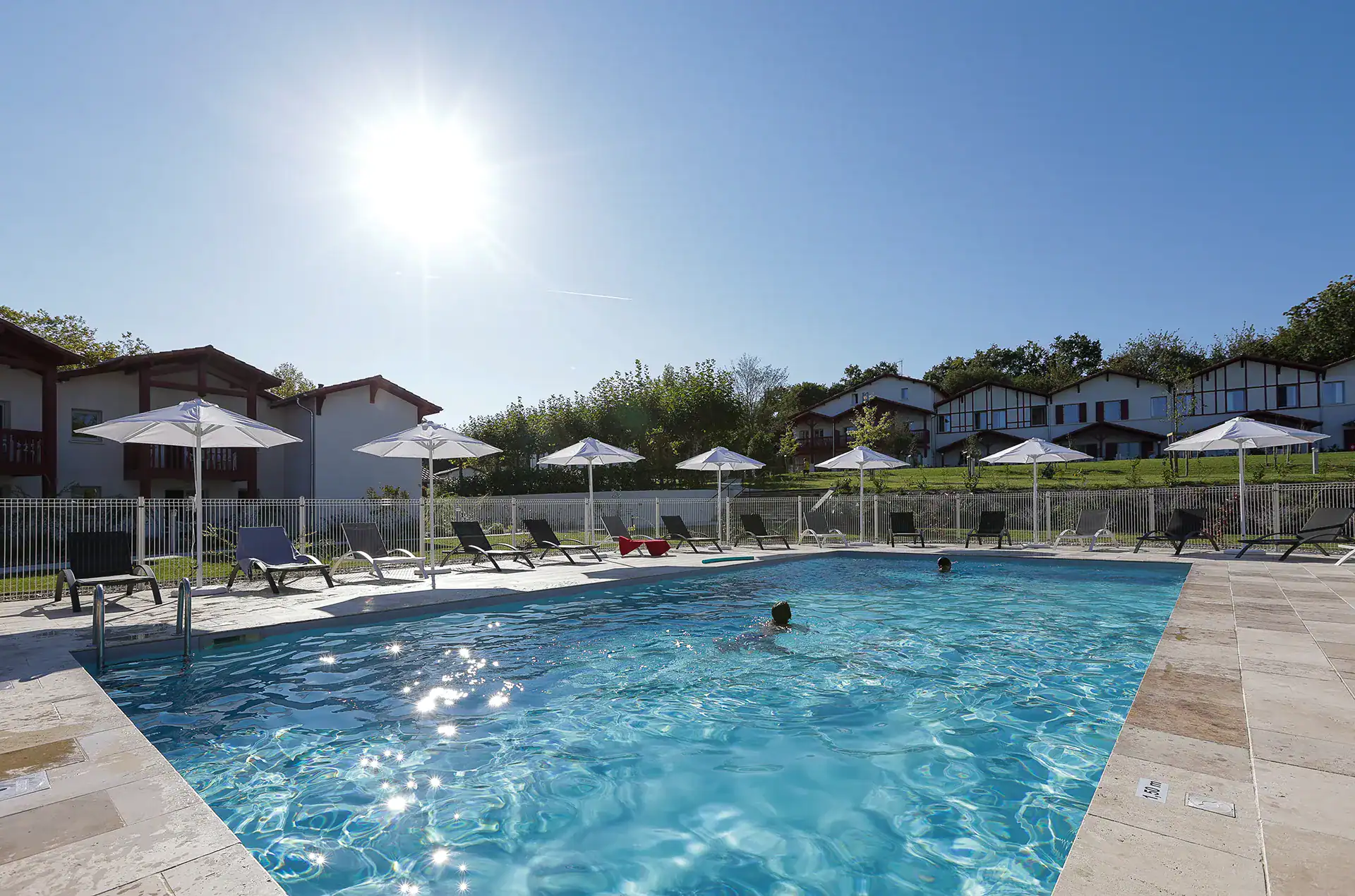 Heated outdoor swimming pool  at the Goélia Le Domaine d'Uhaina holiday residence in Urrugne in the Basque Country