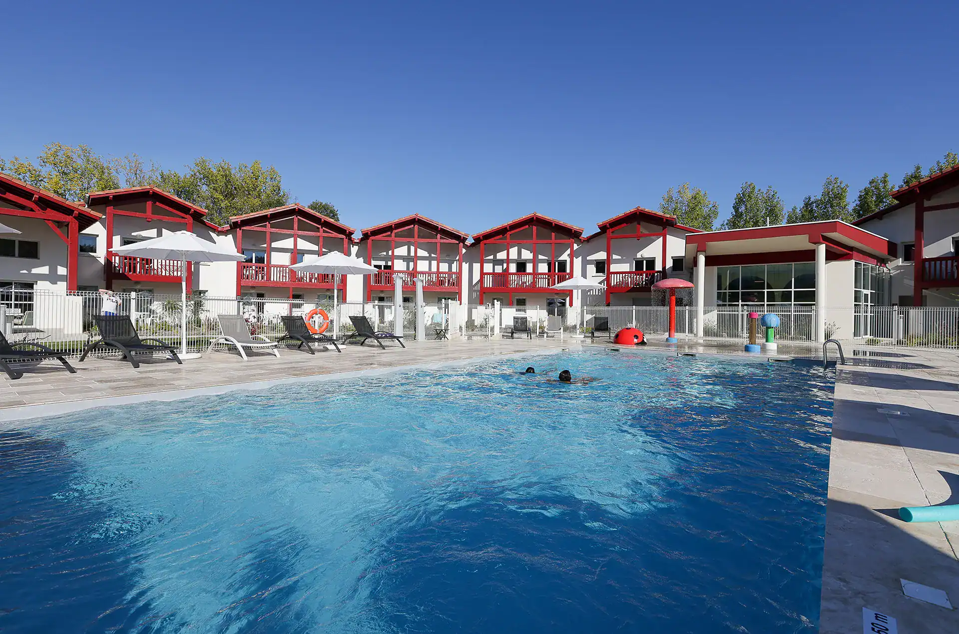 Heated outdoor swimming pool  at the Goélia Le Domaine d'Uhaina holiday residence in Urrugne in the Basque Country