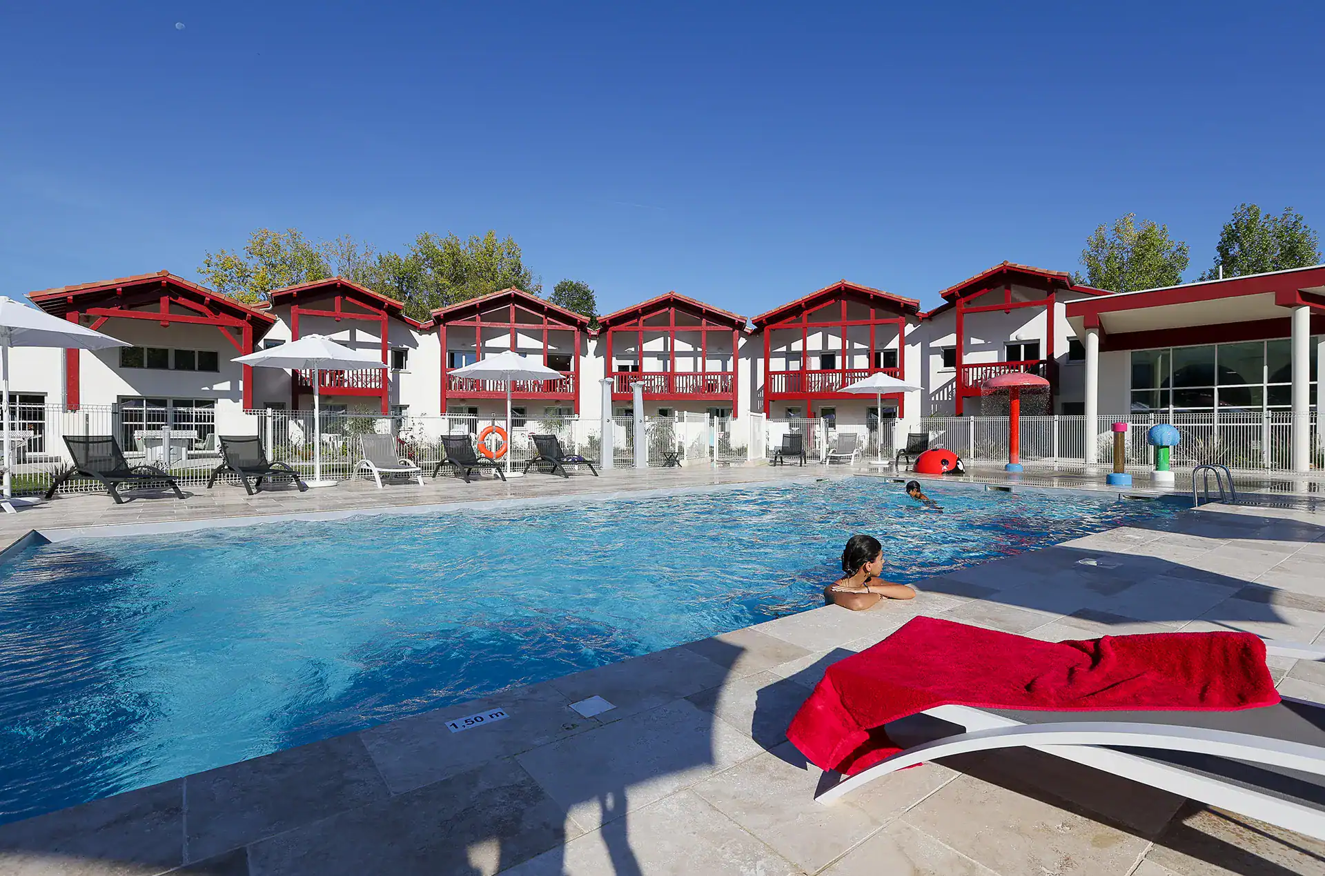 Heated outdoor swimming pool  at the Goélia Le Domaine d'Uhaina holiday residence in Urrugne in the Basque Country