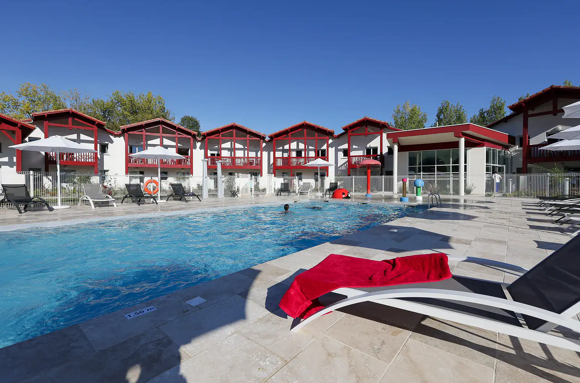 Heated outdoor swimming pool  at the Goélia Le Domaine d'Uhaina holiday residence in Urrugne in the Basque Country