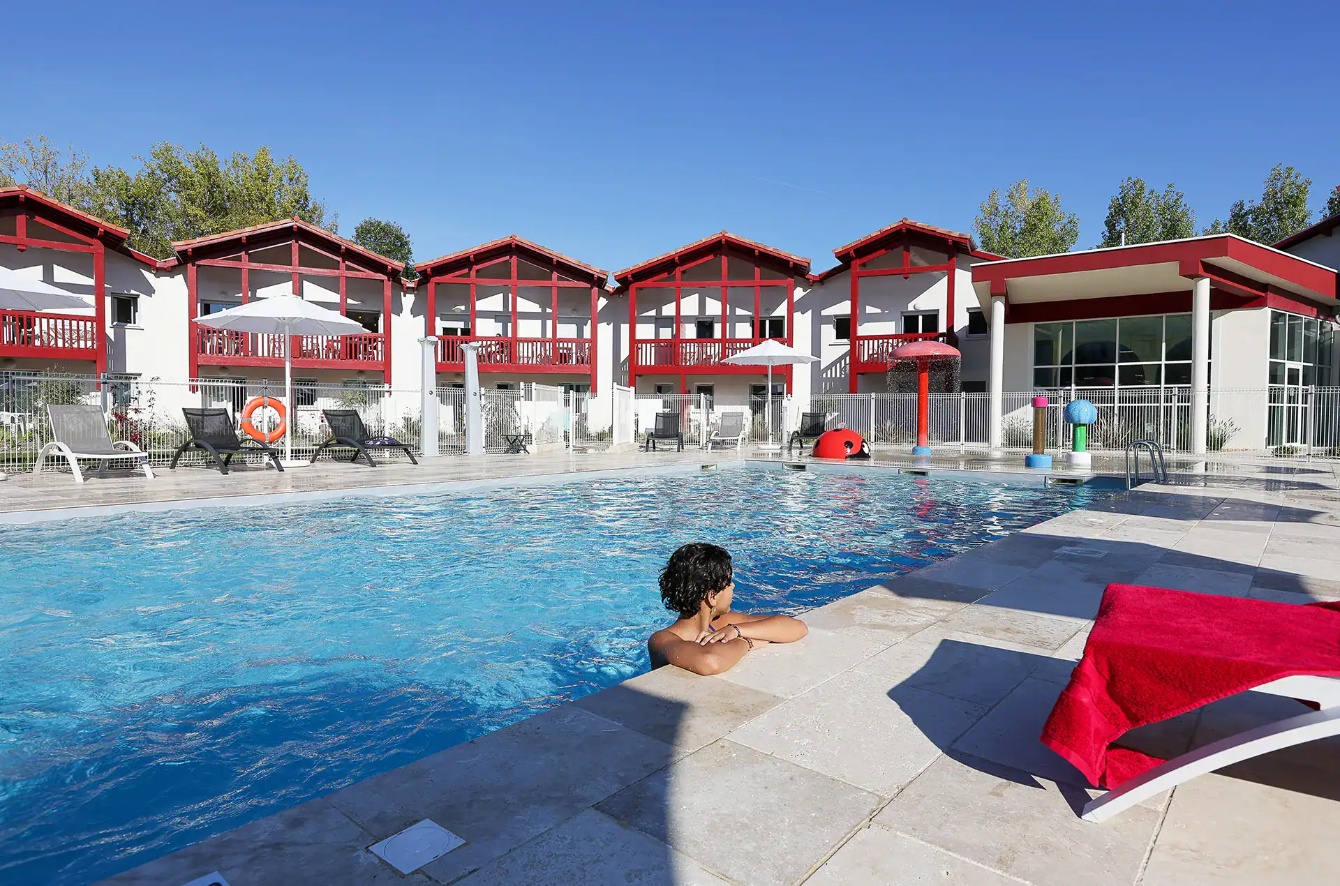 Heated outdoor swimming pool  at the Goélia Le Domaine d'Uhaina holiday residence in Urrugne in the Basque Country