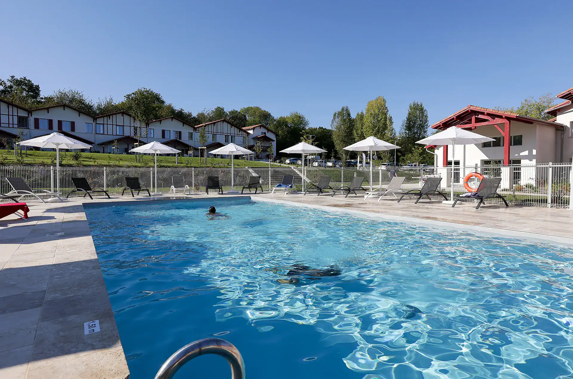 Heated outdoor swimming pool  at the Goélia Le Domaine d'Uhaina holiday residence in Urrugne in the Basque Country