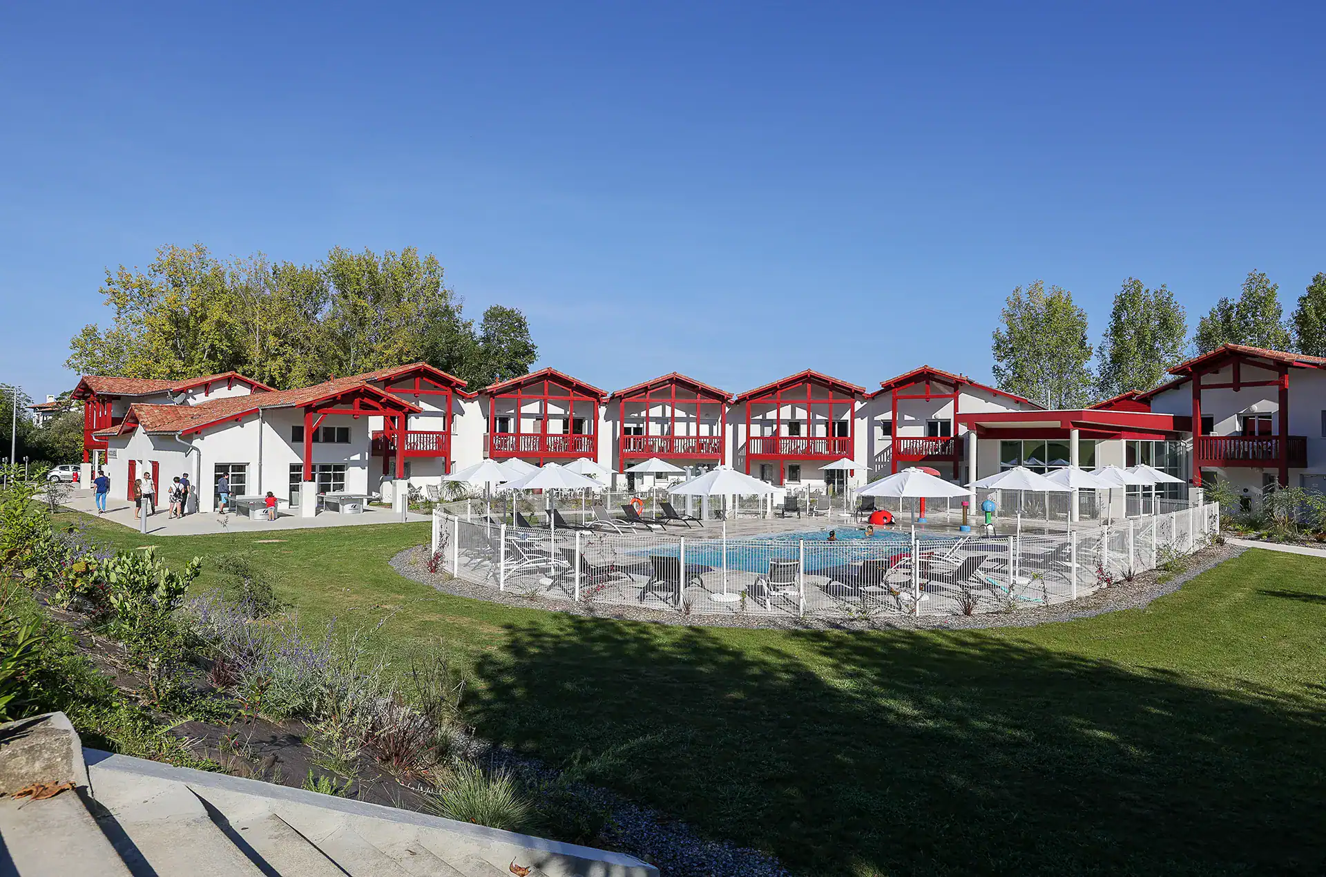 Heated outdoor swimming pool  at the Goélia Le Domaine d'Uhaina holiday residence in Urrugne in the Basque Country