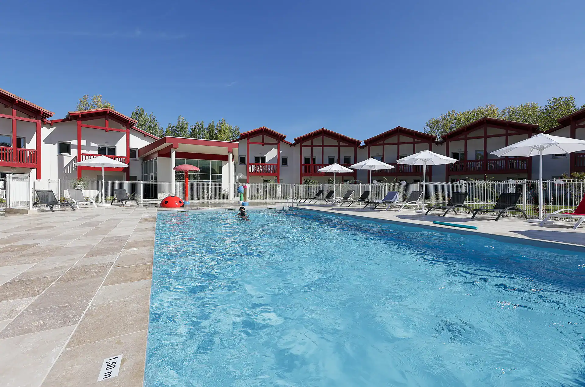 Heated outdoor swimming pool at the Goélia Le Domaine d'Uhaina holiday residence in Urrugne in the Basque Country