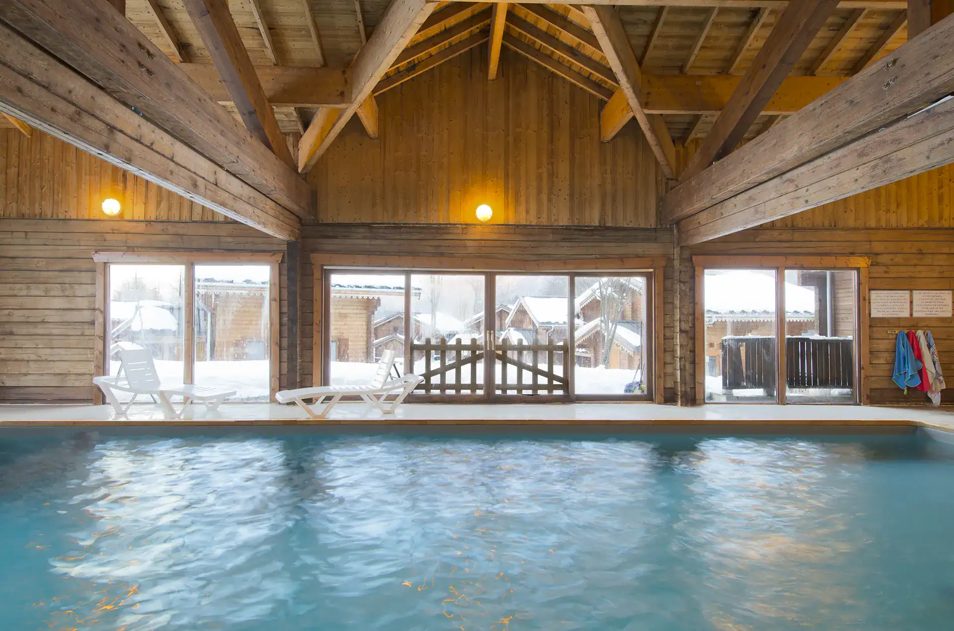 Heated indoor swimming pool Reception area of the Goélia Les Chalets du Bois de Champelle holiday residence in Morillon