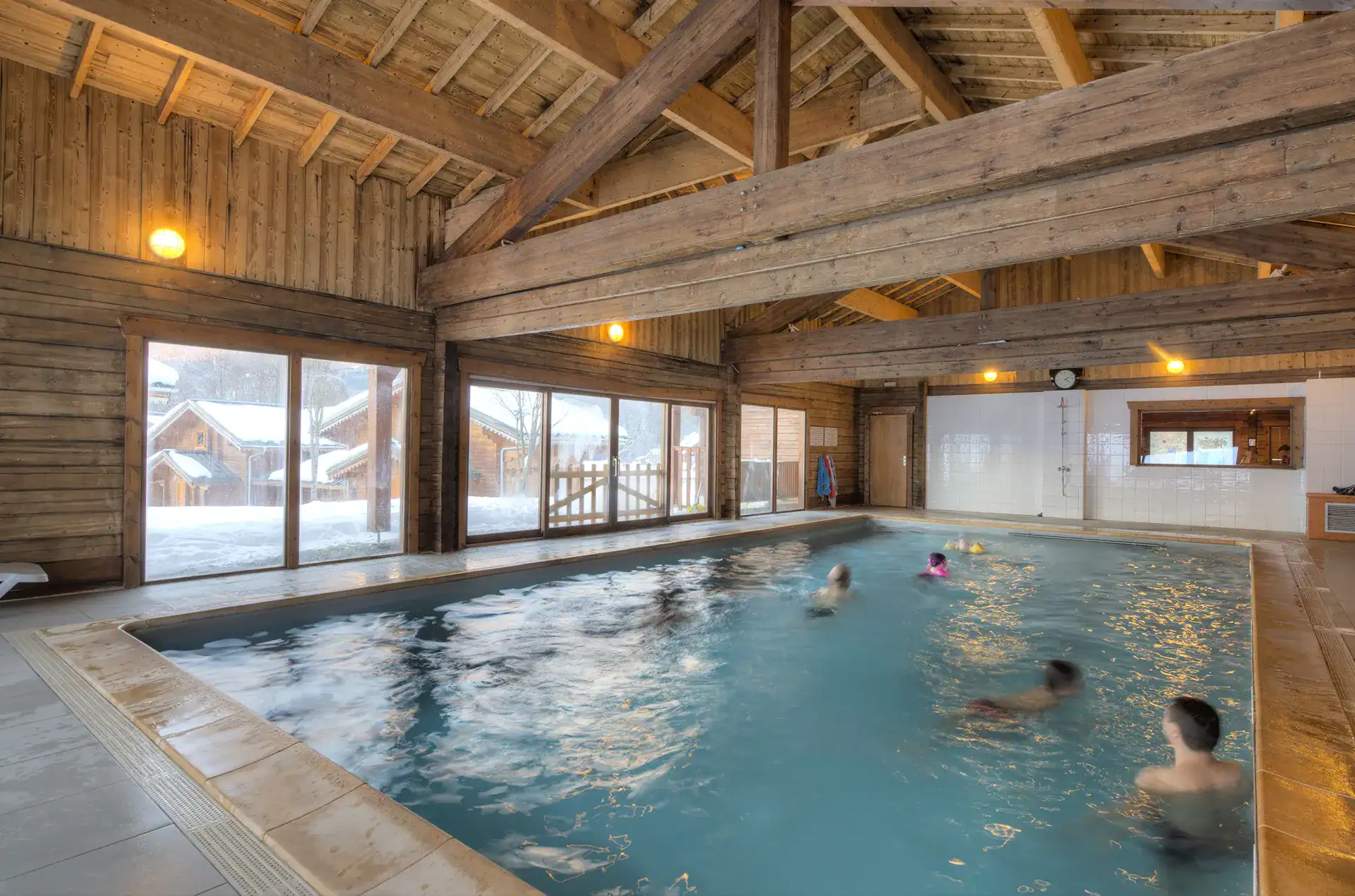 Heated indoor swimming pool Reception area of the Goélia Les Chalets du Bois de Champelle holiday residence in Morillon 