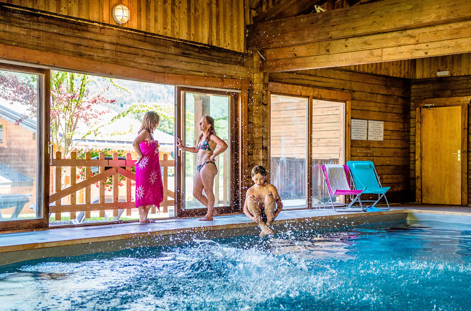 Heated indoor swimming pool at the Goélia Les Chalets du Bois de Champelle holiday residence in M