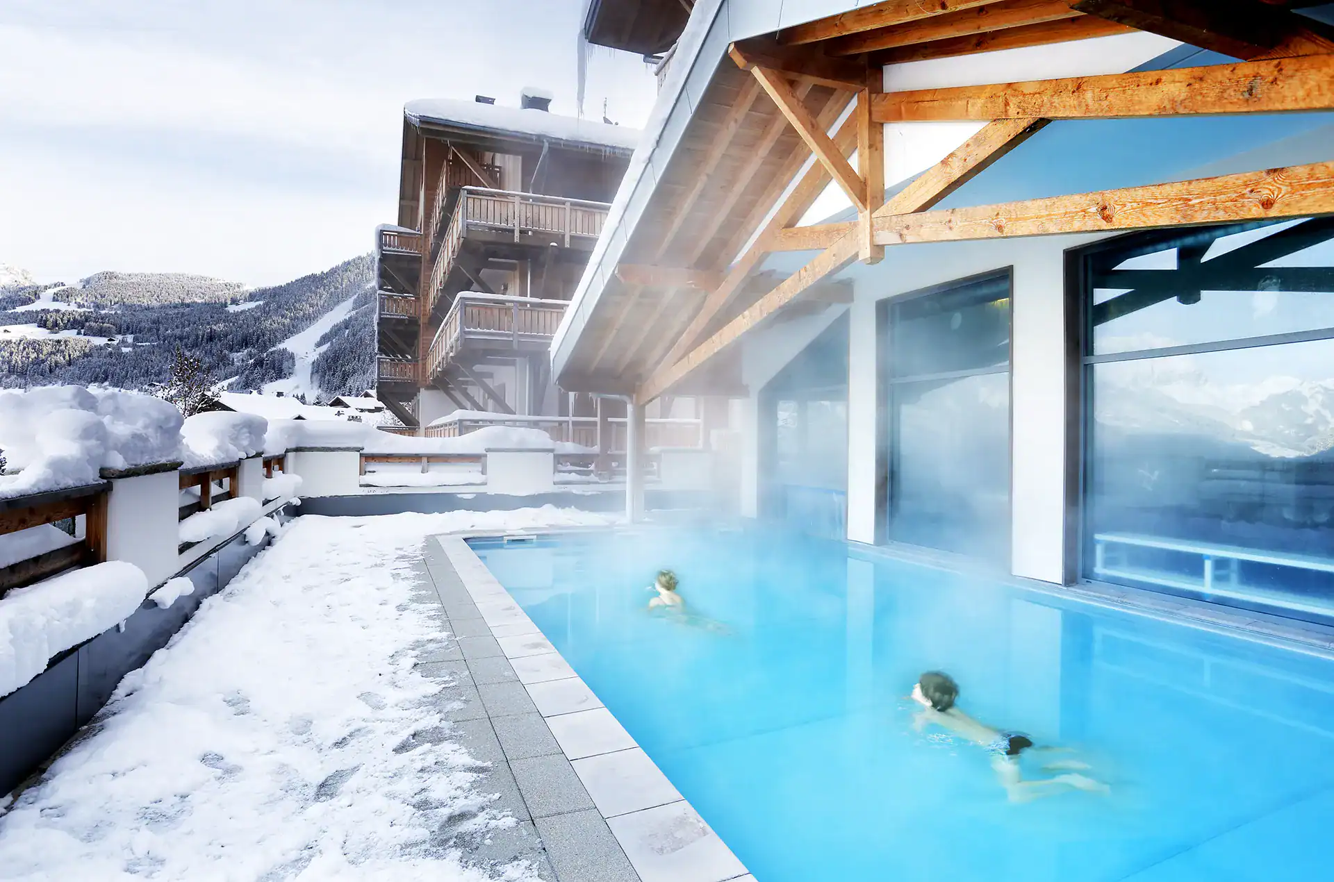 Heated outdoor swimming-pool at the Goélia le Grand Ermitage holiday residence in Châtel