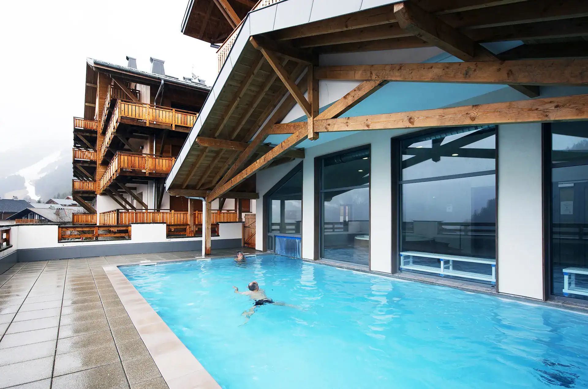 Heated outdoor swimming-pool at the Goélia le Grand Ermitage holiday residence in Châtel