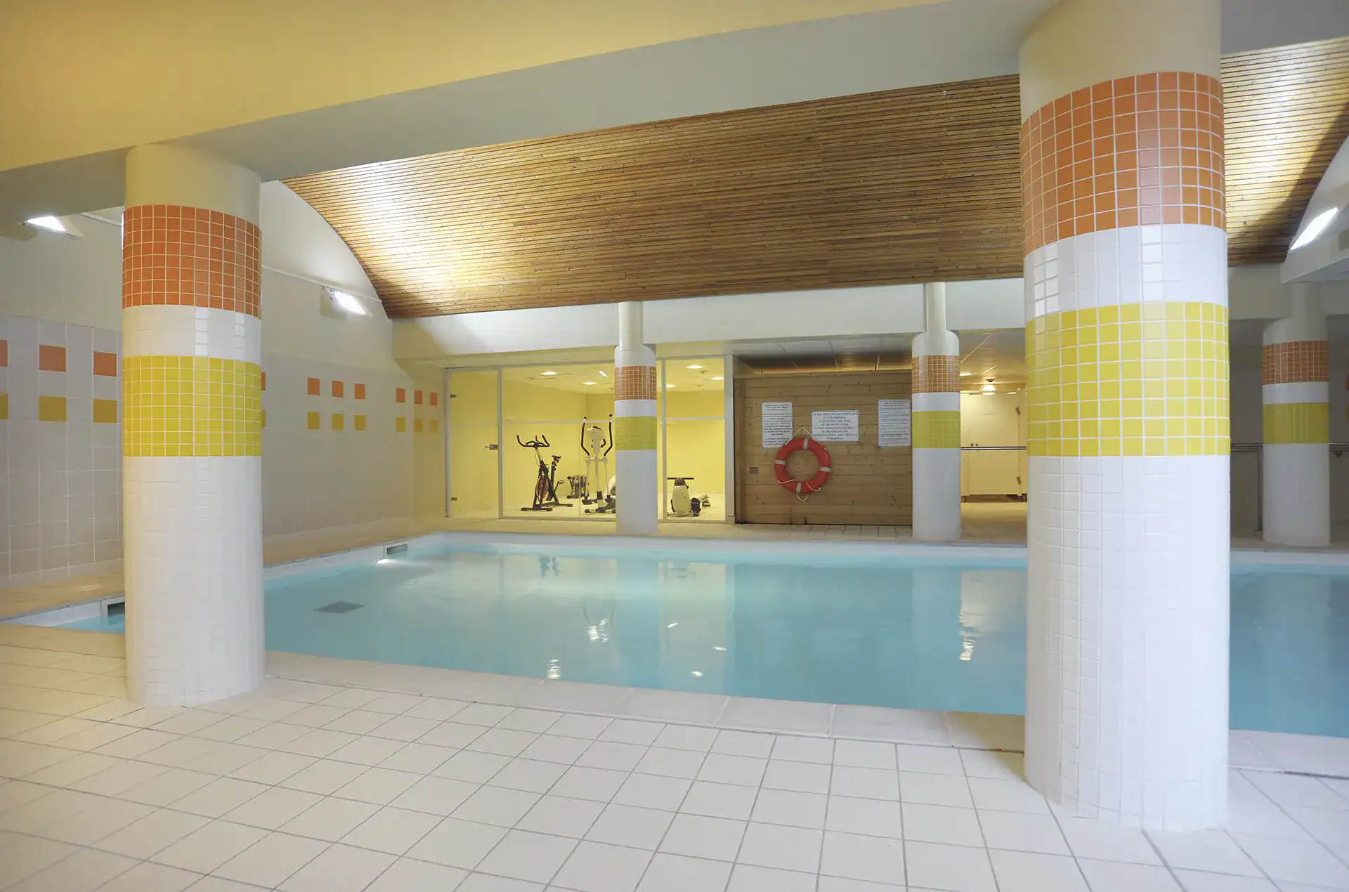 Heated indoor swimming pool at the Goelia Les Grands Ax holiday residence in Ax Les Thermes