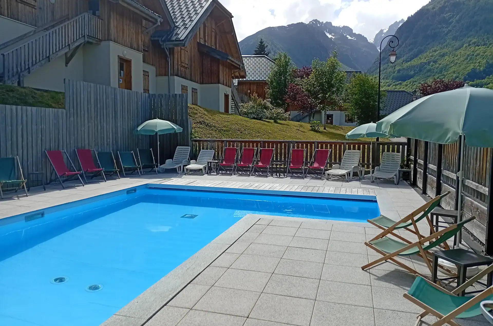 Exterior interior heated pool on the vacation residence Goélia Les Chalets de Belledonne in St Colomban Les Sybelles