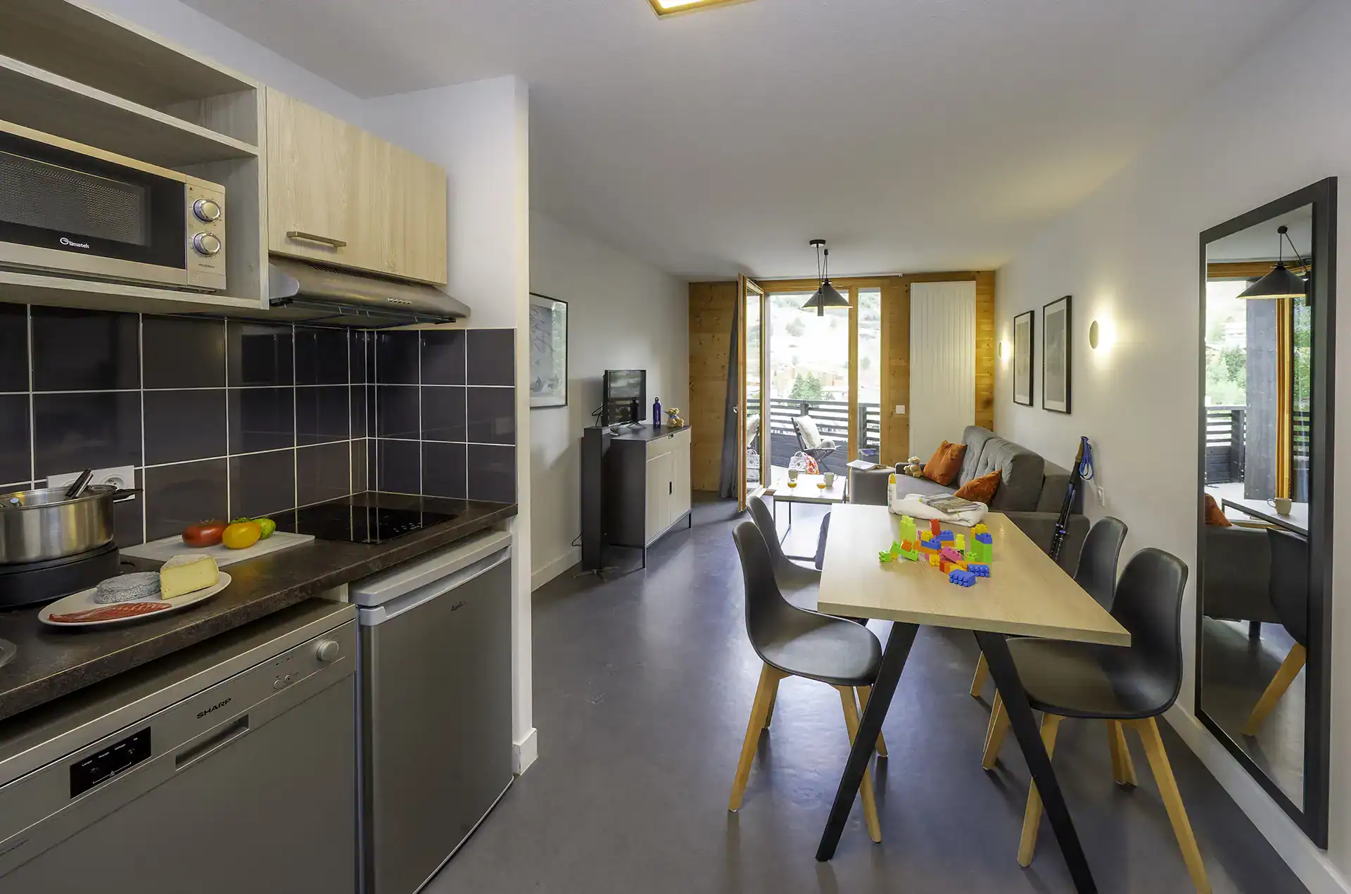 An example of a kitchenette in one of the holiday apartments at the Le Hameau holiday residence in Les Deux Alpes
